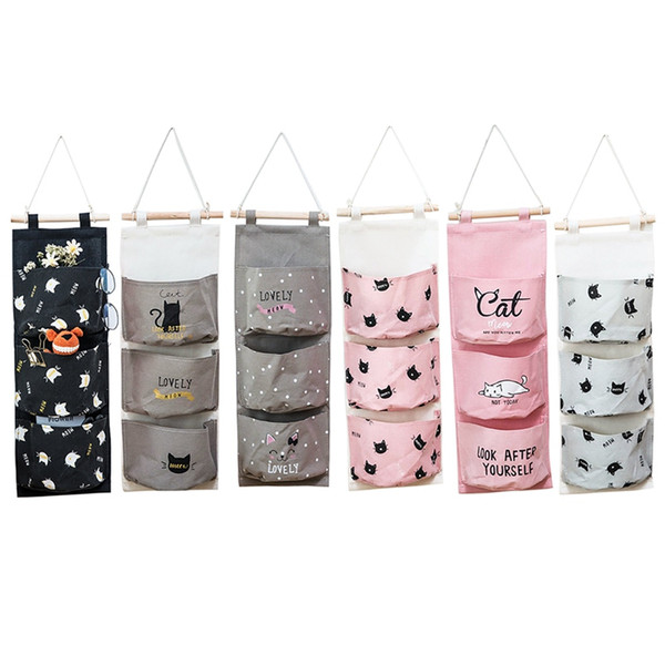 convenient and portable linen cotton fabric wall mounted three pockets storage bag wall door hanging storage pockets *